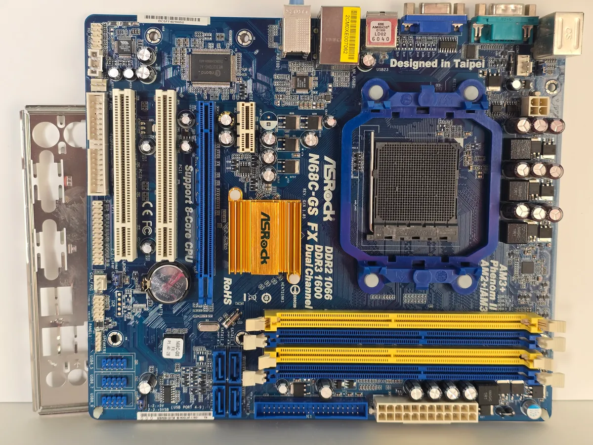 Материнська плата ASRock N68C-GS FX (Socket AM3+, DDR3/DDR2, б/у) купити в Україні